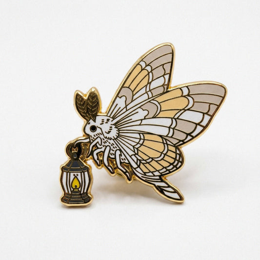 Moth and Lamp pin (gold and white variant): white moth with yellow and grey wings holding a gold-plated lantern.