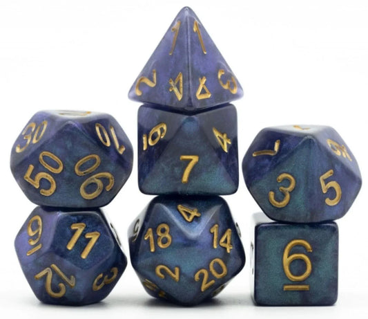 Six Caribbean Cruise RPG dice, blue-purple with gold numbers, stacked in a pyramid on white background.