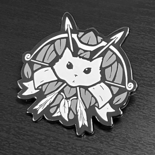 Ranger Enamel Pin showing a stylized cat face with arrows and ribbons, black nickel plated.