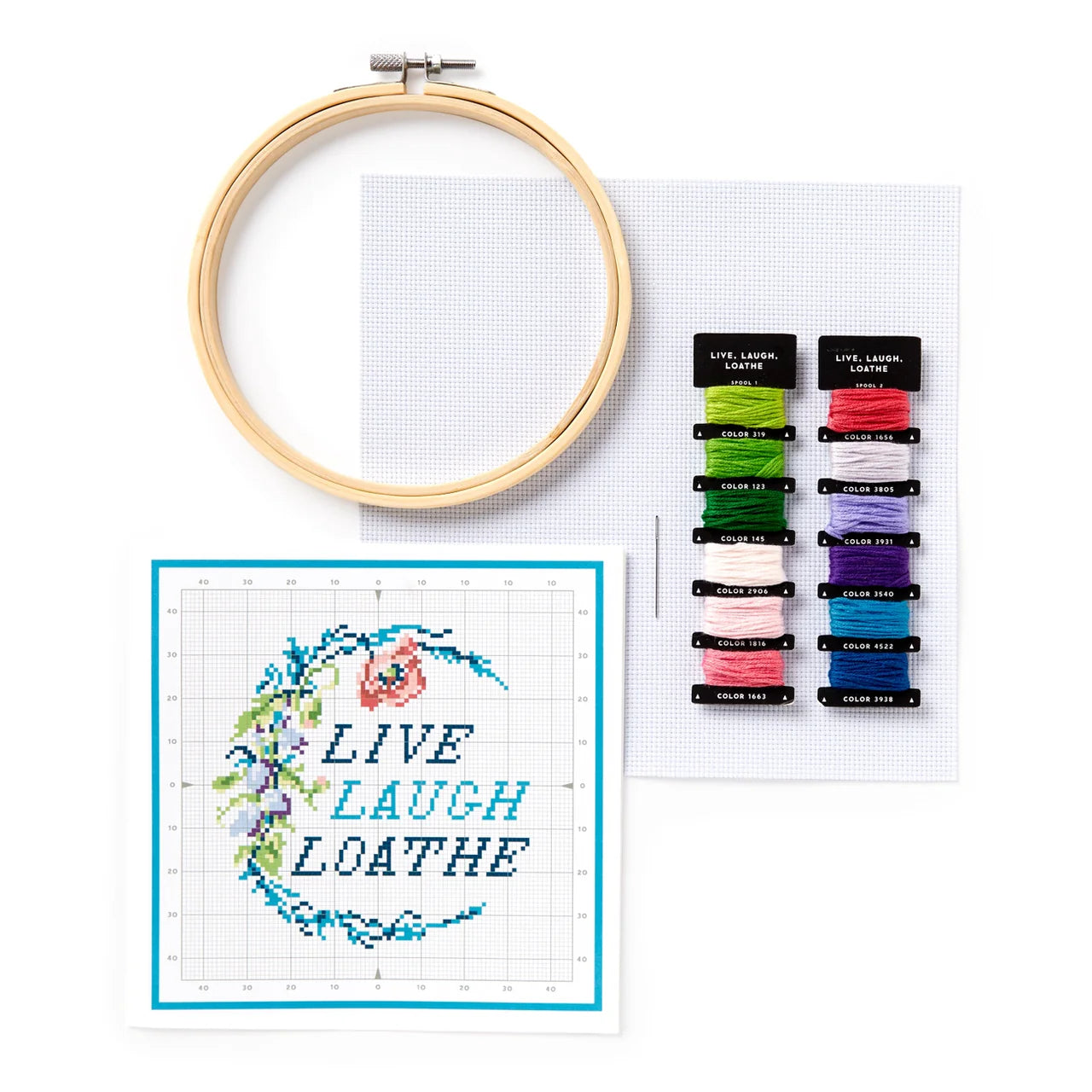 Live Laugh Loathe Cross Stitch Kit for beginners with hoop, thread, fabric, and floral border pattern.