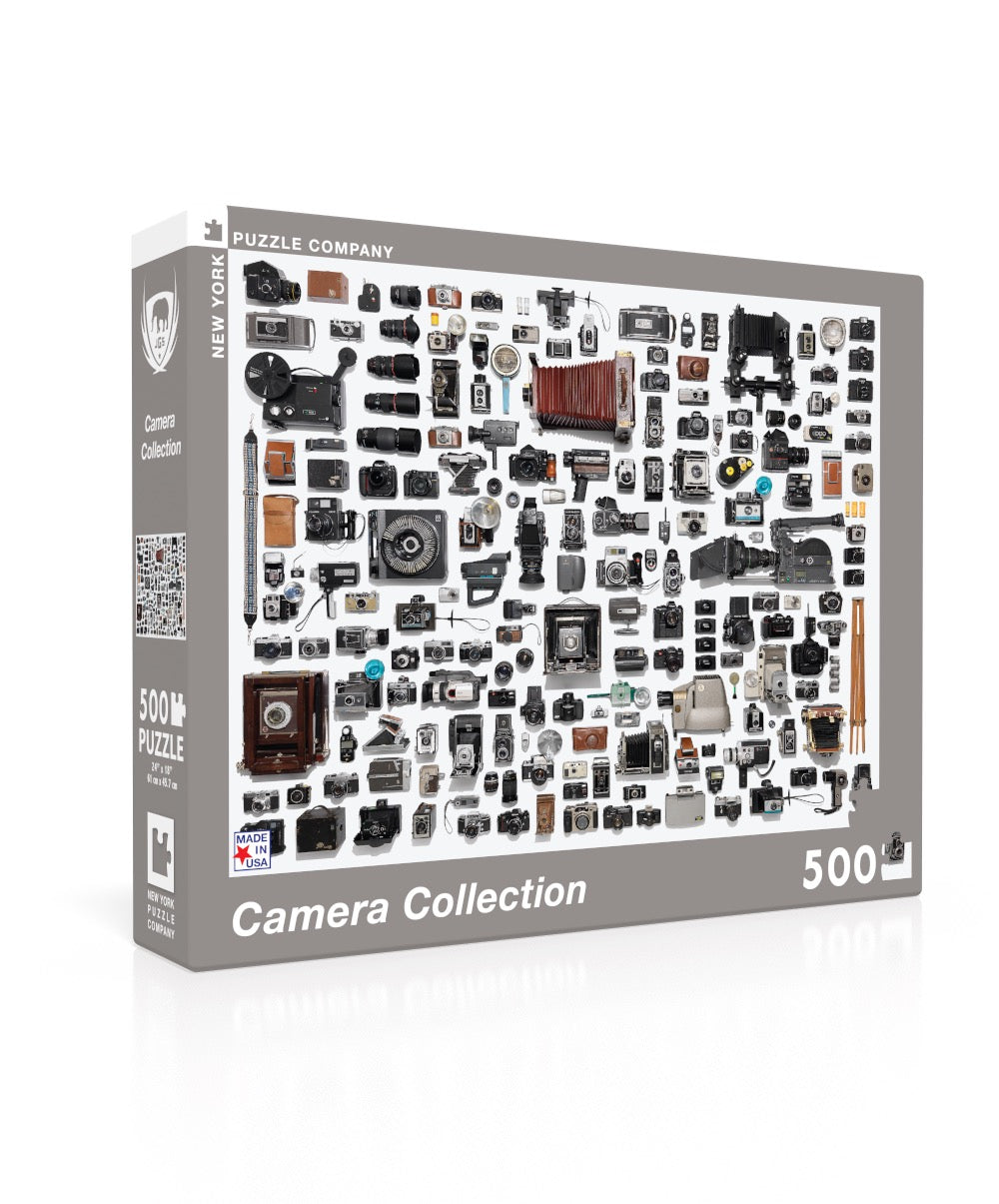 Camera Collection 500 Pc Puzzle from The New Yorker showing vintage cameras on a white background.
