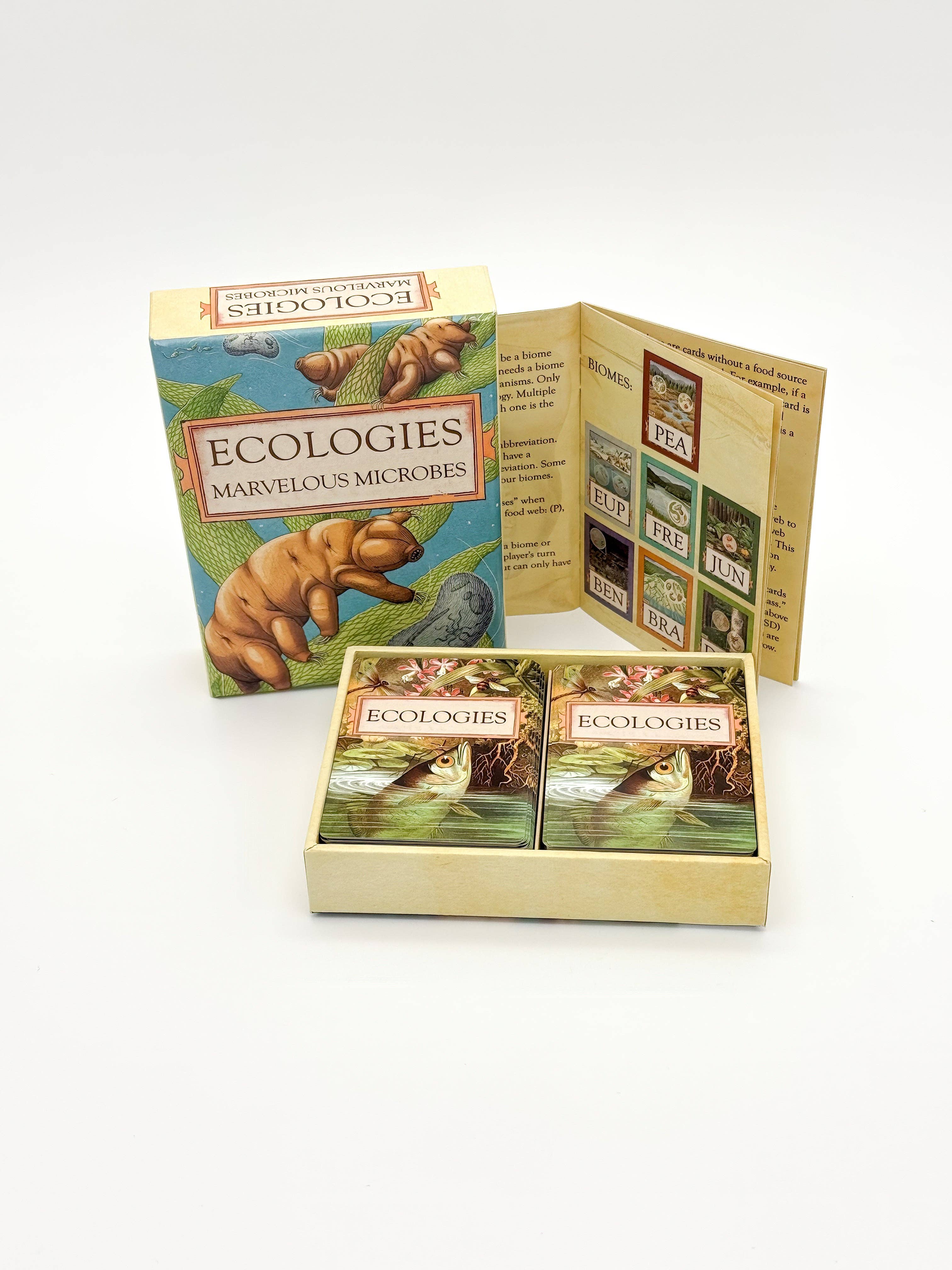 Ecologies: Marvelous Microbes game box, cards with illustrated microbes, and instruction sheet.