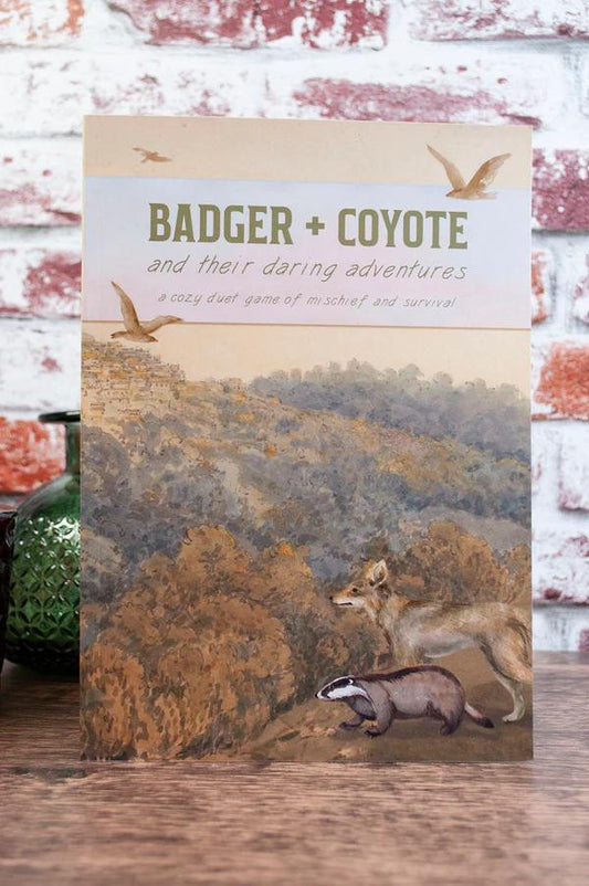 Badger & Coyote 2-player tabletop RPG game cover featuring illustrated animals in a forest landscape.