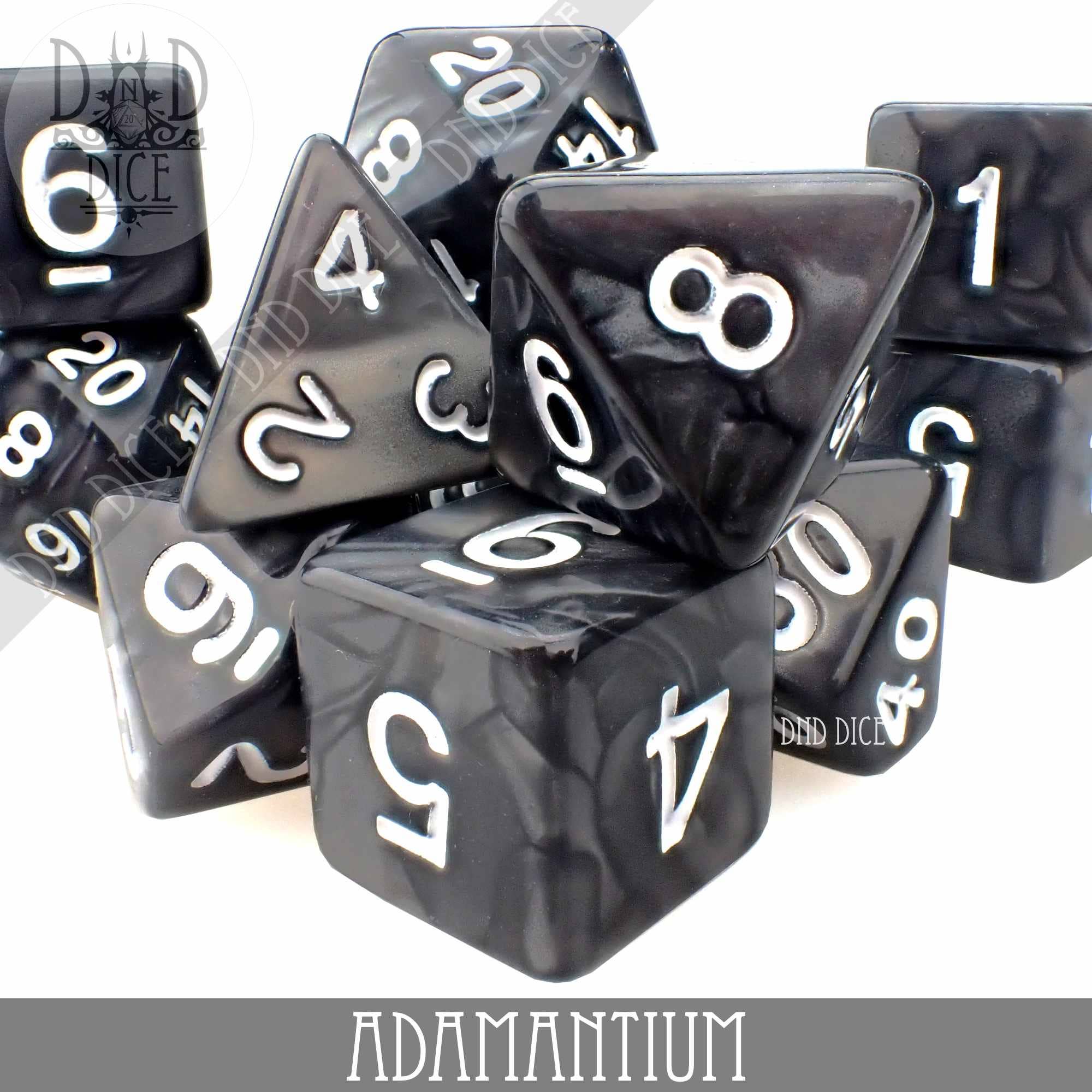 Black acrylic Adamantium 7-dice set with white numbers.