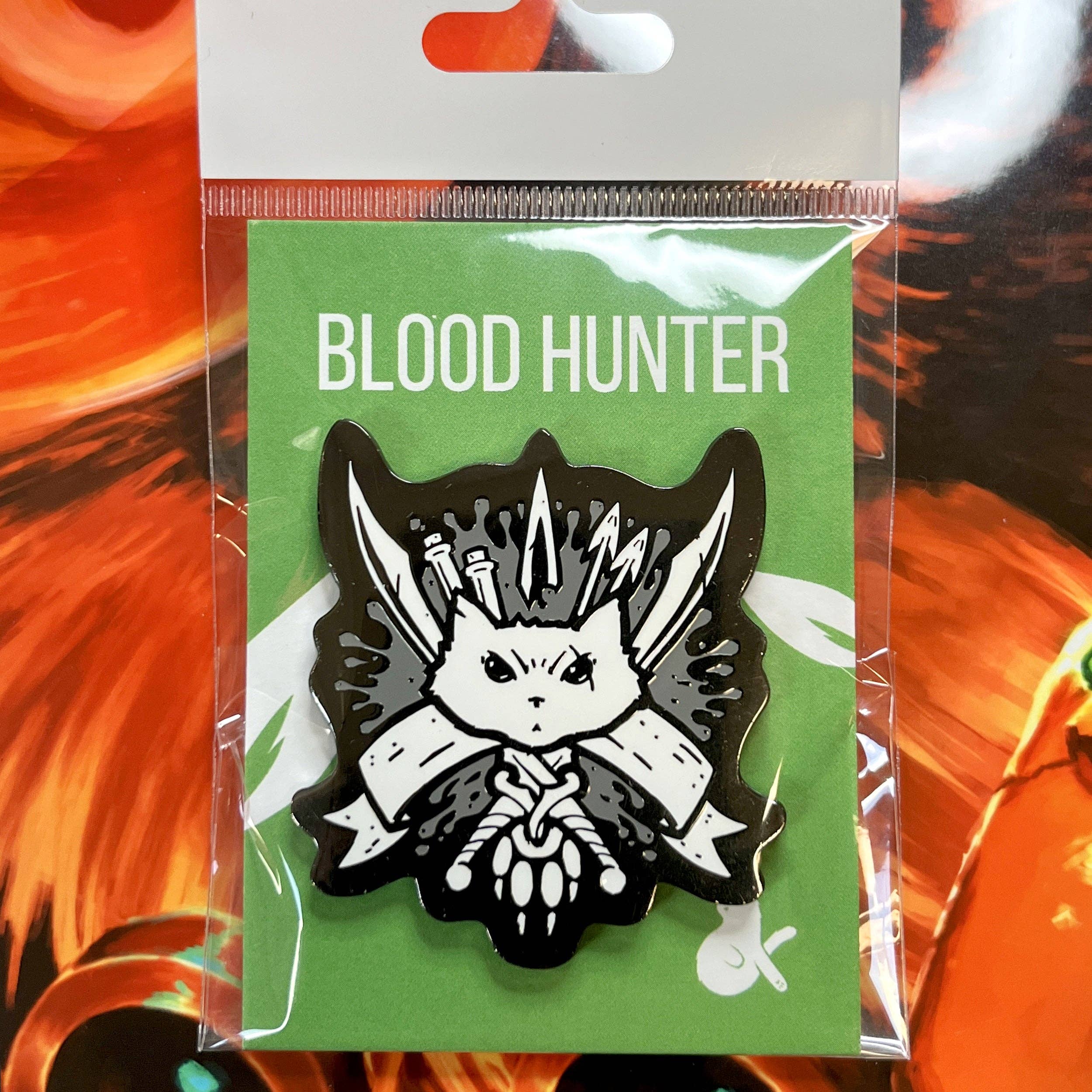 Blood Hunter Enamel Pin showing a stylized cat with knives and ribbon on a green background.