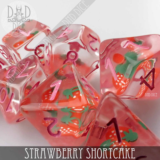 Strawberry Shortcake 7-piece clear resin dice set with embedded strawberry slices and pink numbers.
