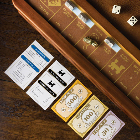 Monopoly Luxury Edition board with property cards and collectible pieces.