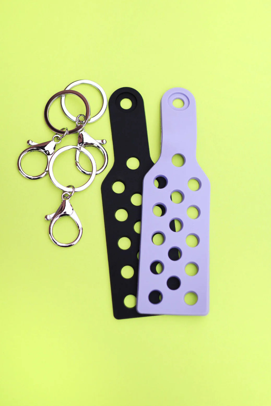Two Lady Moon Shoe Charm Keychains with metal clasps and tags.