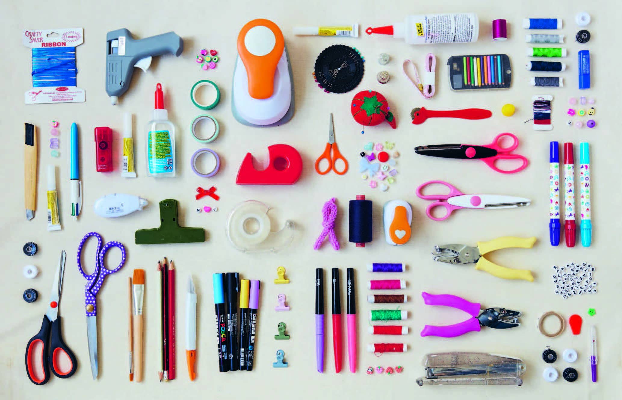 The Art of Memory Collecting supplies set with scissors, glue, tape, and markers for collage or scrapbooking.