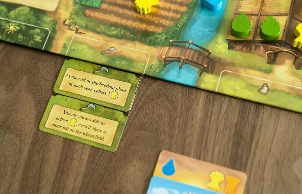 Beer & Bread 2-player card game with farming strategy cards and wooden resource pieces shown close up.