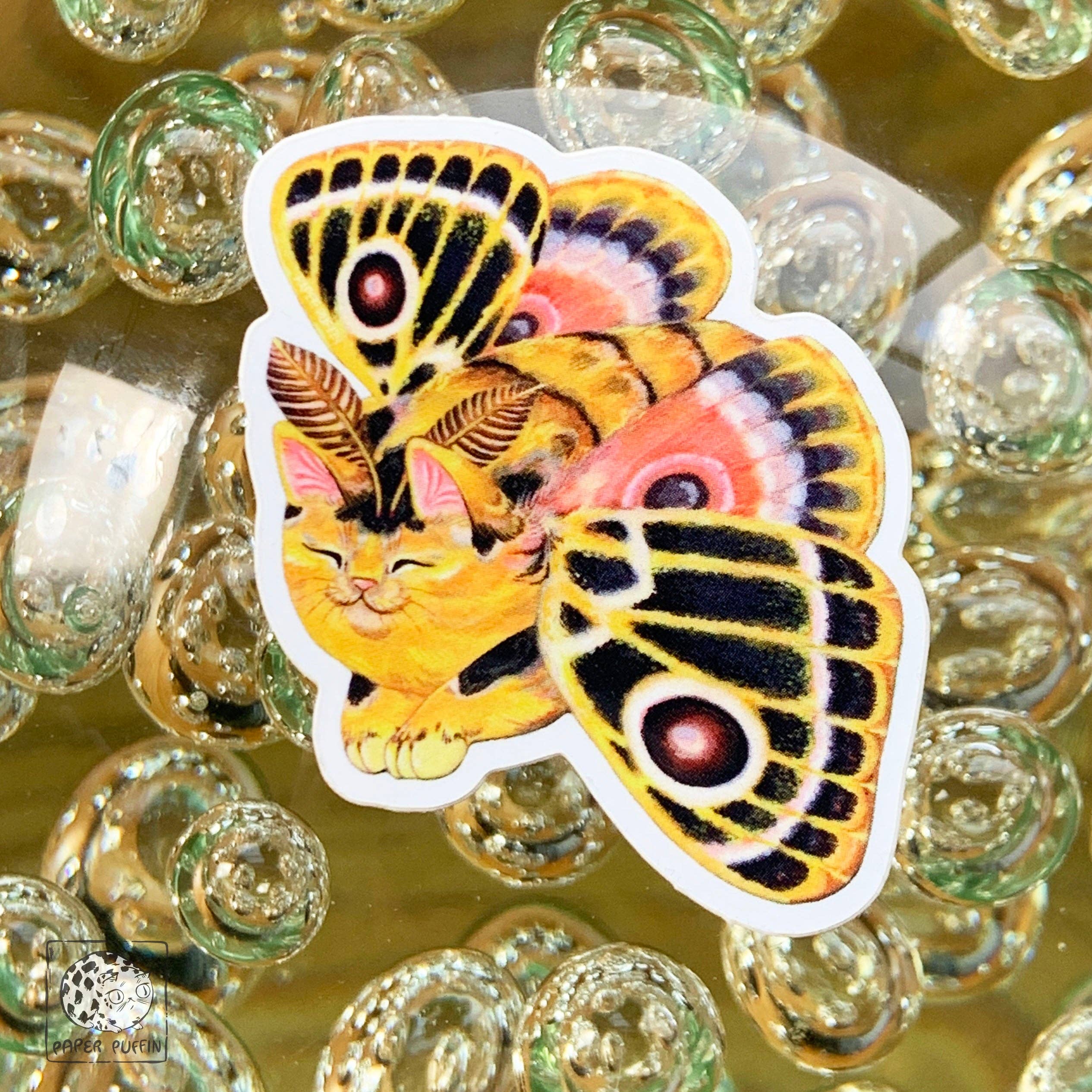 Die-cut Moth Cat Vivid Joy sticker featuring a sleeping orange moth cat with colorful art.
