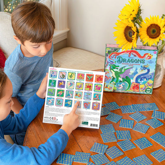 Dragons Shiny Memory & Matching Game being played by two children at a table.