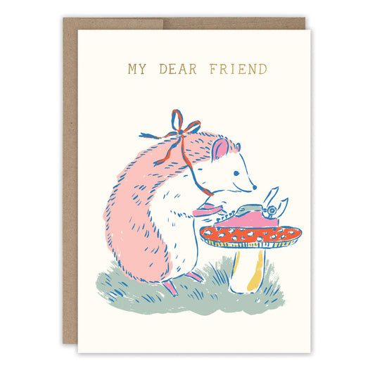 My Dear Friend Hedgehog Friendship Card featuring a hedgehog trimming a mushroom under the text MY DEAR FRIEND.