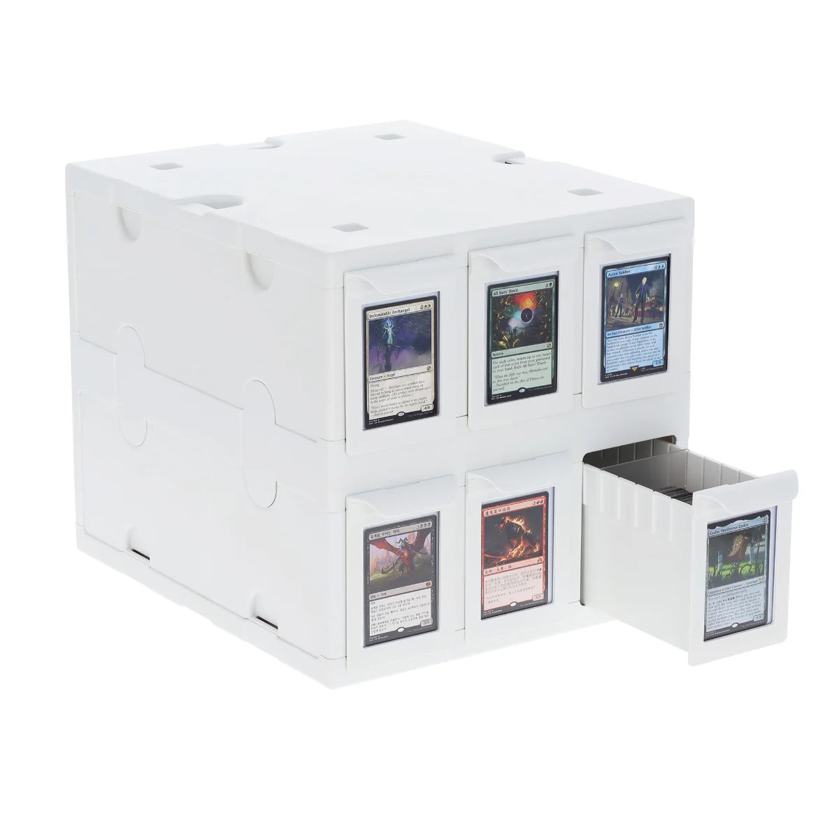 White cube organizer with six small labeled drawers, one drawer partially open.
