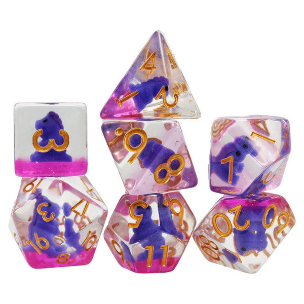Clear dice with gold numbers, pink tint, and a purple T-Rex figure inside.