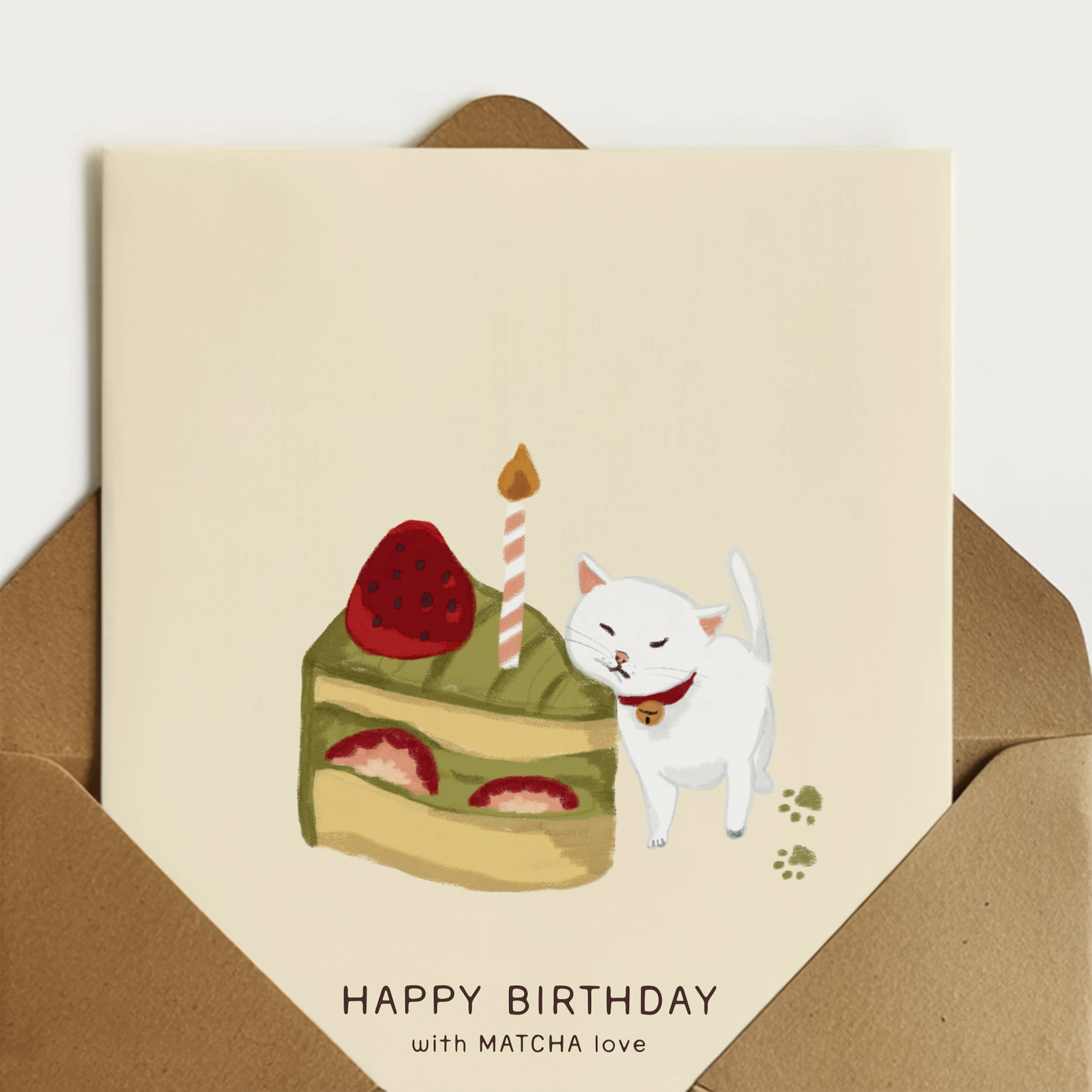 Matcha Cat Birthday Card featuring a cat, cake, and candle with Japanese aesthetic elements.