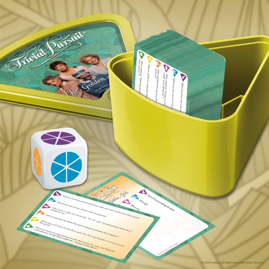 TRIVIAL PURSUIT: GOLDEN GIRLS game with heart-shaped box, question cards, and white die.