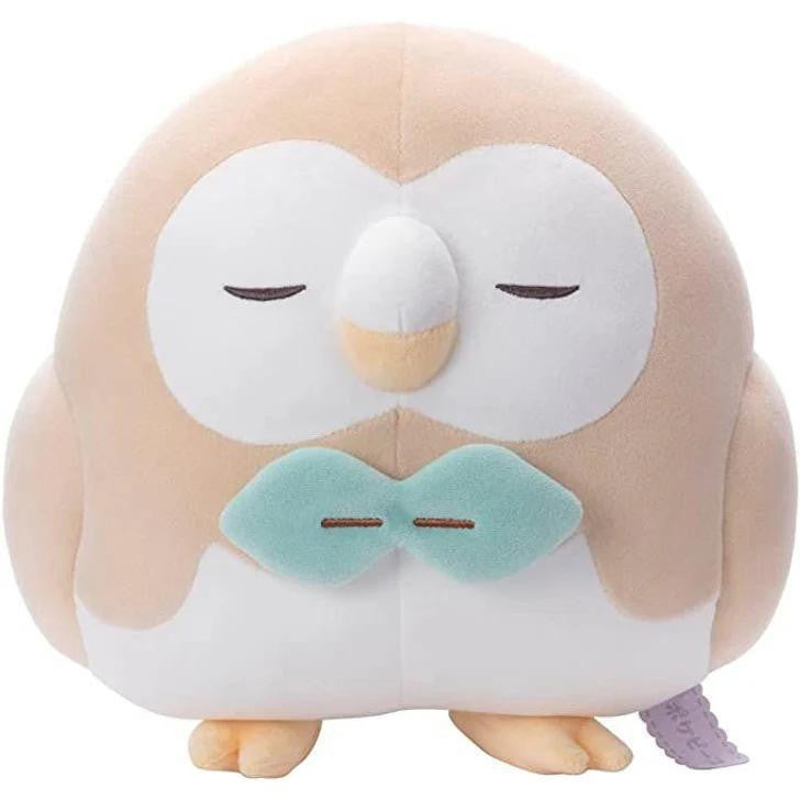 Rowlet Plush Pokemon Poke Peace with closed eyes, light brown body, blue bow tie, sitting upright.