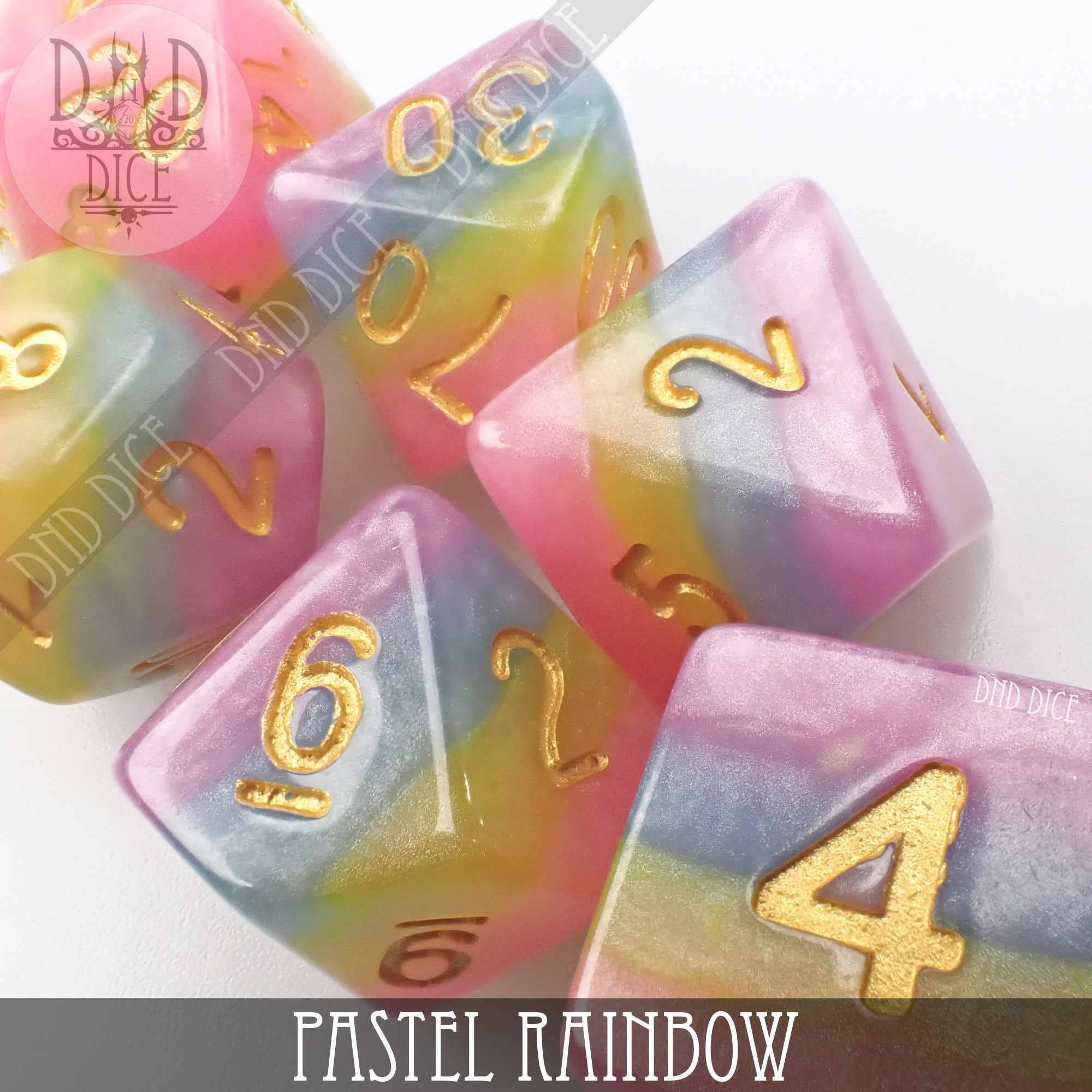 Pastel Rainbow 7-dice resin set with gold numbers for DnD and tabletop games.
