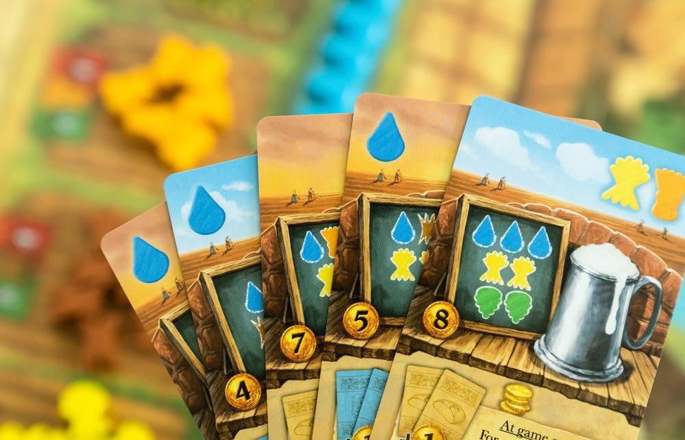 Beer & Bread two-player card game featuring illustrated cards, water drop icons, and resource management rewards.