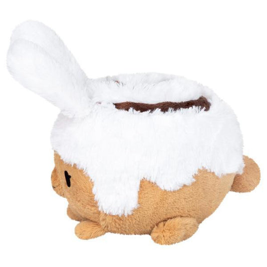 Mini Squishable Cinnabunny plush toy shaped like a cinnamon roll with white icing and a swirl on top.
