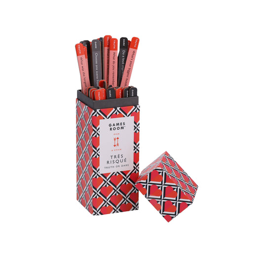 Tres Risque Truth or Dare couples game in a red patterned box with sticks.