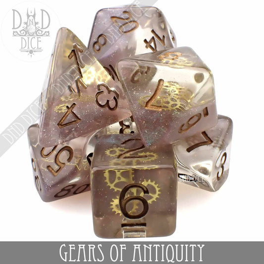 Set of 7 translucent resin DND dice with gold numbers and embedded tiny gear decorations.