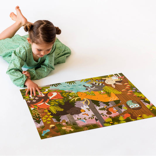 Enchanted Woodland 24-Piece Floor Puzzle with colorful animal shapes being assembled on the floor.