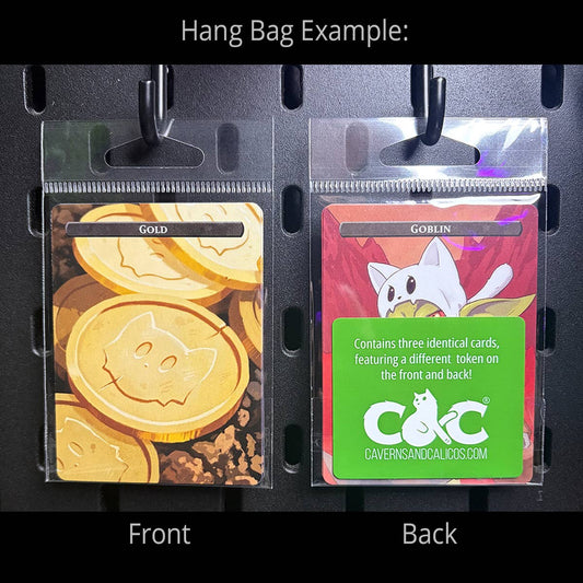Hero Token Set packs with cat-themed MtG cards; front Gold, back Goblin card and green sticker visible.