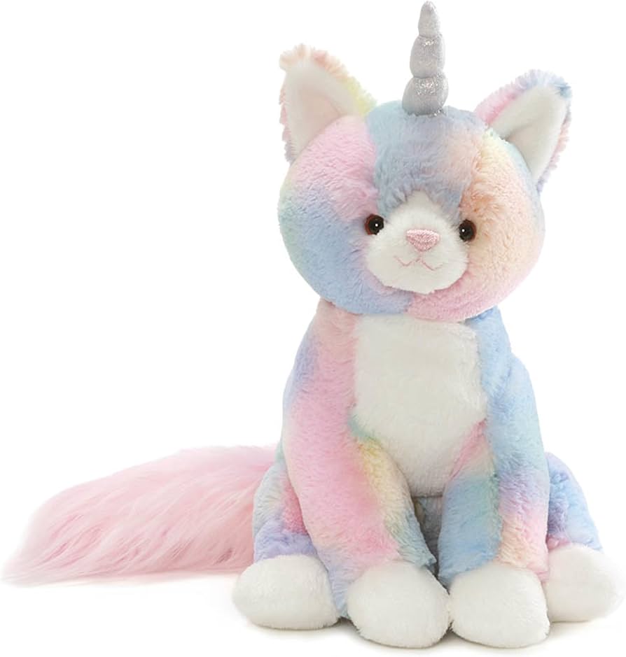 Shimmer Caticorn plush with unicorn horn and pink tail, sitting on a white background.