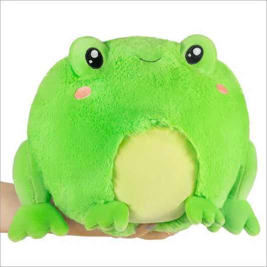 Mini Squishable Frog (7) plush with big eyes, blushing cheeks, and a light yellow belly held in a hand.