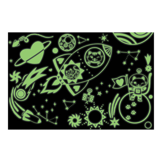Cosmic Dreams 100 Piece Glow in the Dark Puzzle featuring cats, rockets, and stars on a black background.