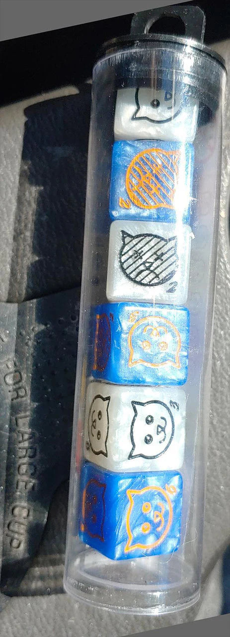 Cat Dice tube with six six-sided dice in two colors, featuring Catthulhu faces and yarn balls.