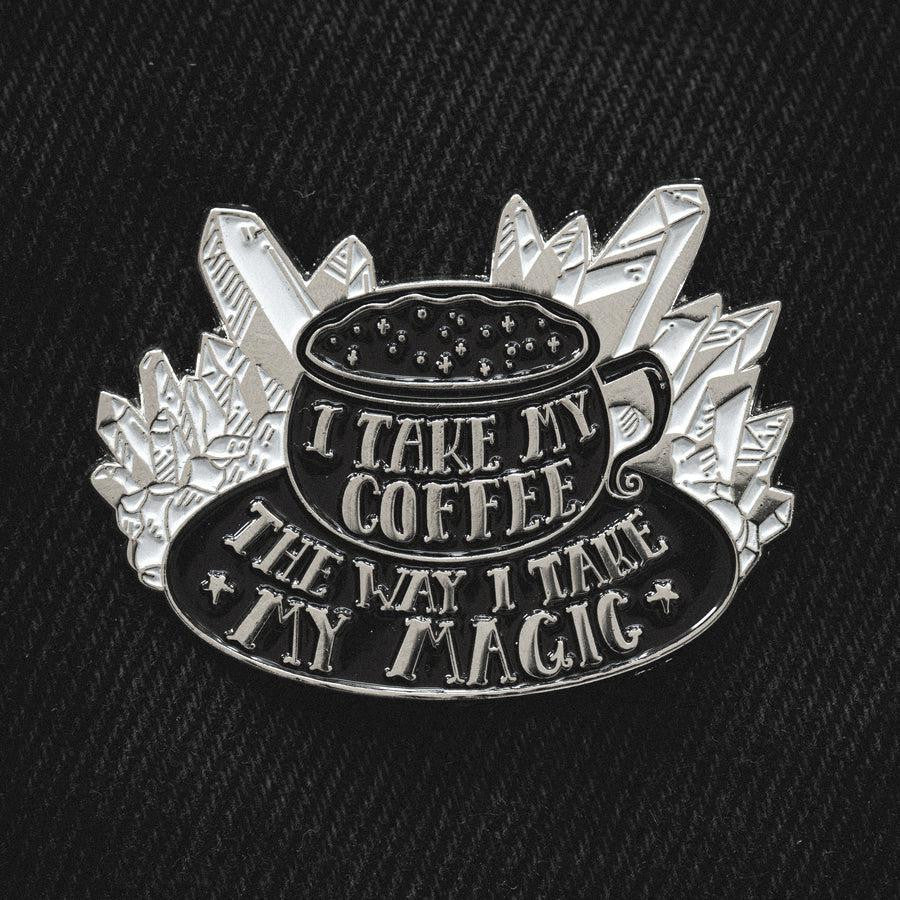 I Take My Coffee The Way I Take My Magic enamel pin with witch-themed design.