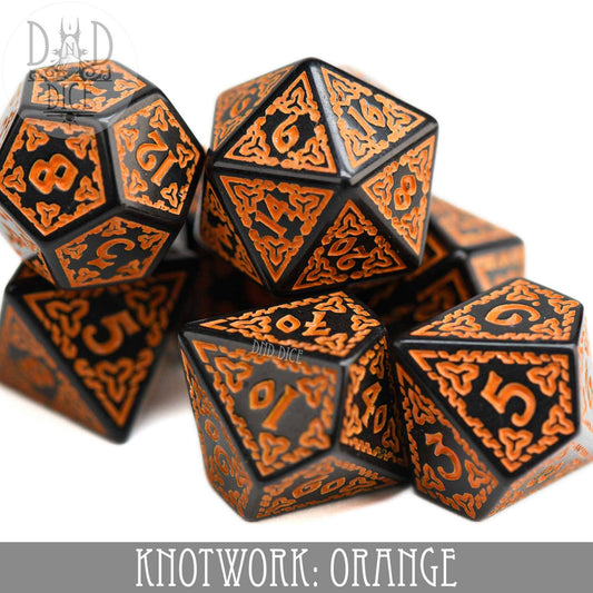 Knotwork: Orange set of 7 orange and black acrylic dice with intricate knotwork designs.