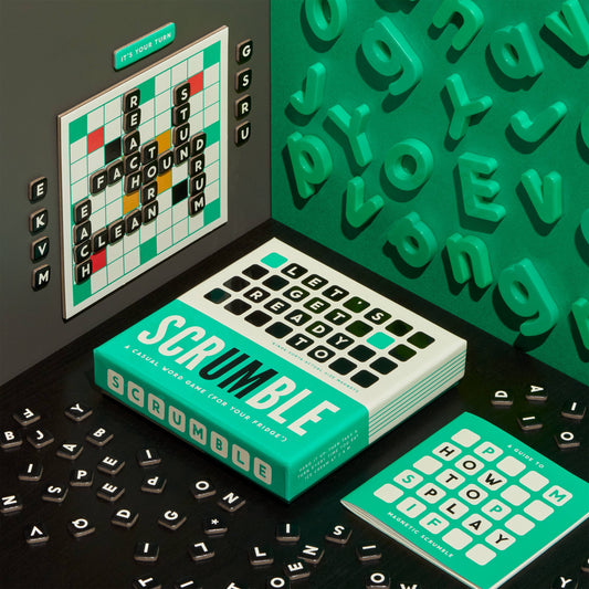 Scrumble Magnetic Fridge Game with letter tiles, rule sheet, and board displaying REACH, STUD, and CLEAN.