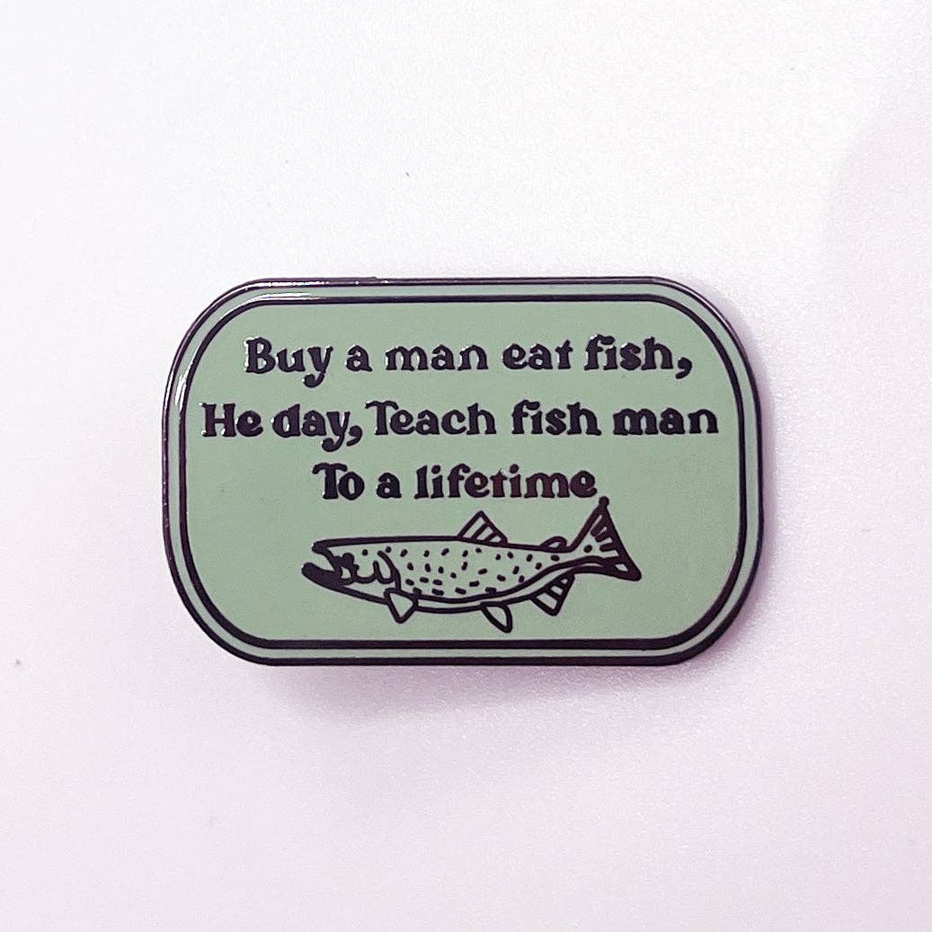 1.25″ hard enamel pin with text: Buy a man eat fish, He day, Teach fish man To a lifetime.