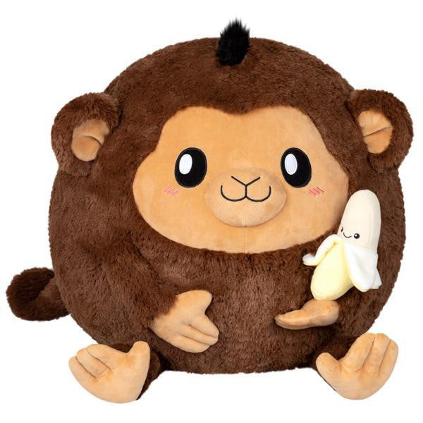 14 Squishable Monkey with Banana, a round plush toy with cartoon features and blushing cheeks.