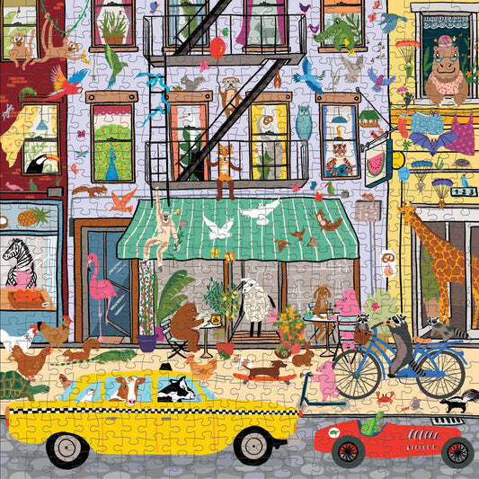 Critter City 500 Piece Family Puzzle featuring animals, bicycles, a taxi, and a red car near buildings.
