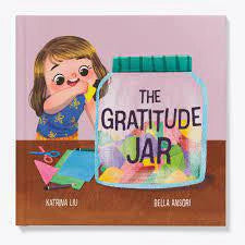 The Gratitude Jar product held by a smiling girl, filled with colorful notes.