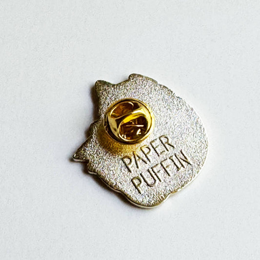 Back of Book Reader Cat enamel pin with a gold-tone butterfly clutch and embossed PAPER PUFFIN logo.
