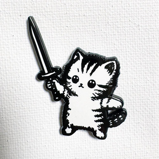 Sword Kitty pin: 1.25-inch black nickel enamel kitten with a sword, rubber clutch backing.
