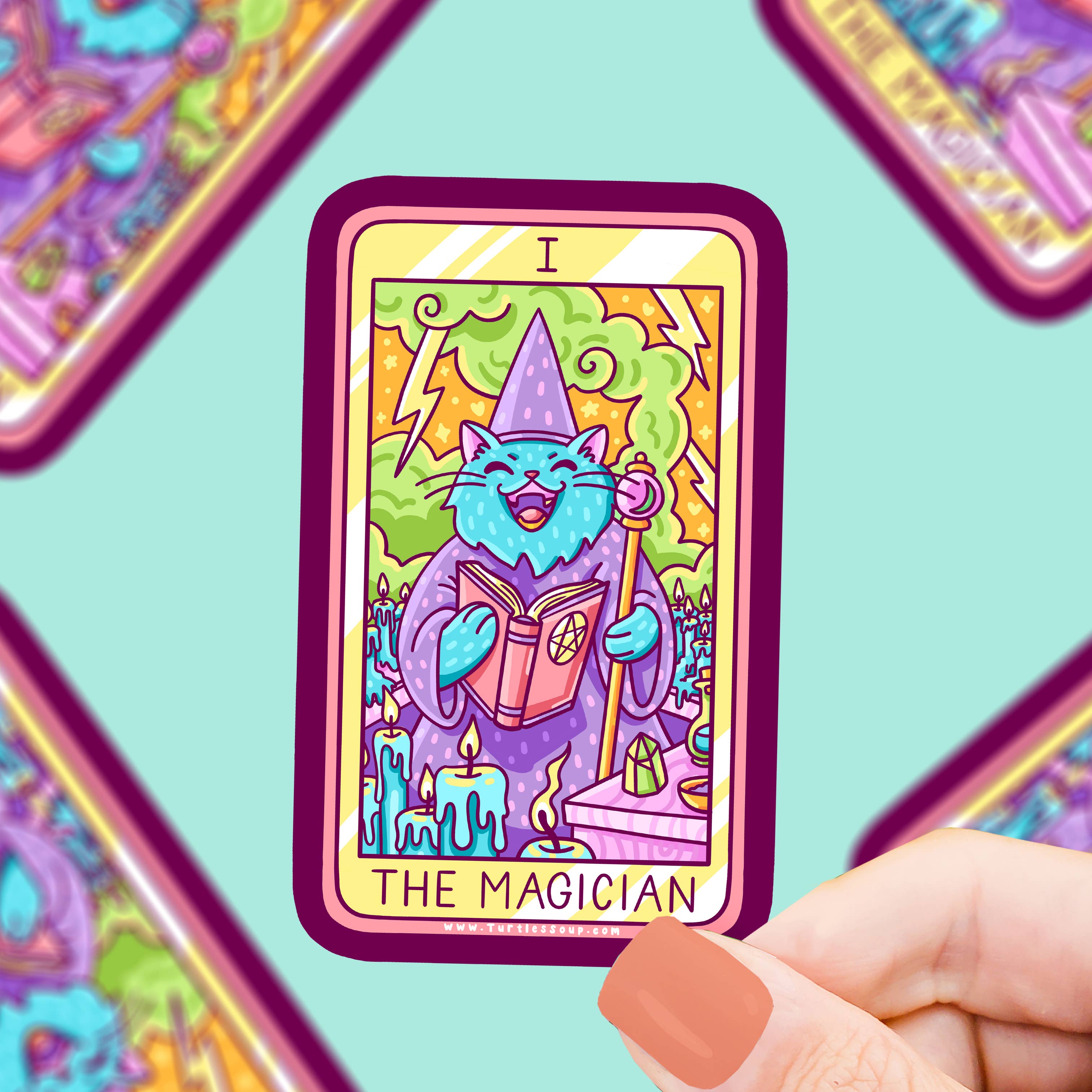 The Magician Kitty Cat Major Arcana Tarot Card Vinyl Sticker held in a hand. Waterproof, tarot-themed cat sticker.
