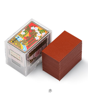 Nintendo Hanafuda red back cards stacked next to a box with Japanese designs.