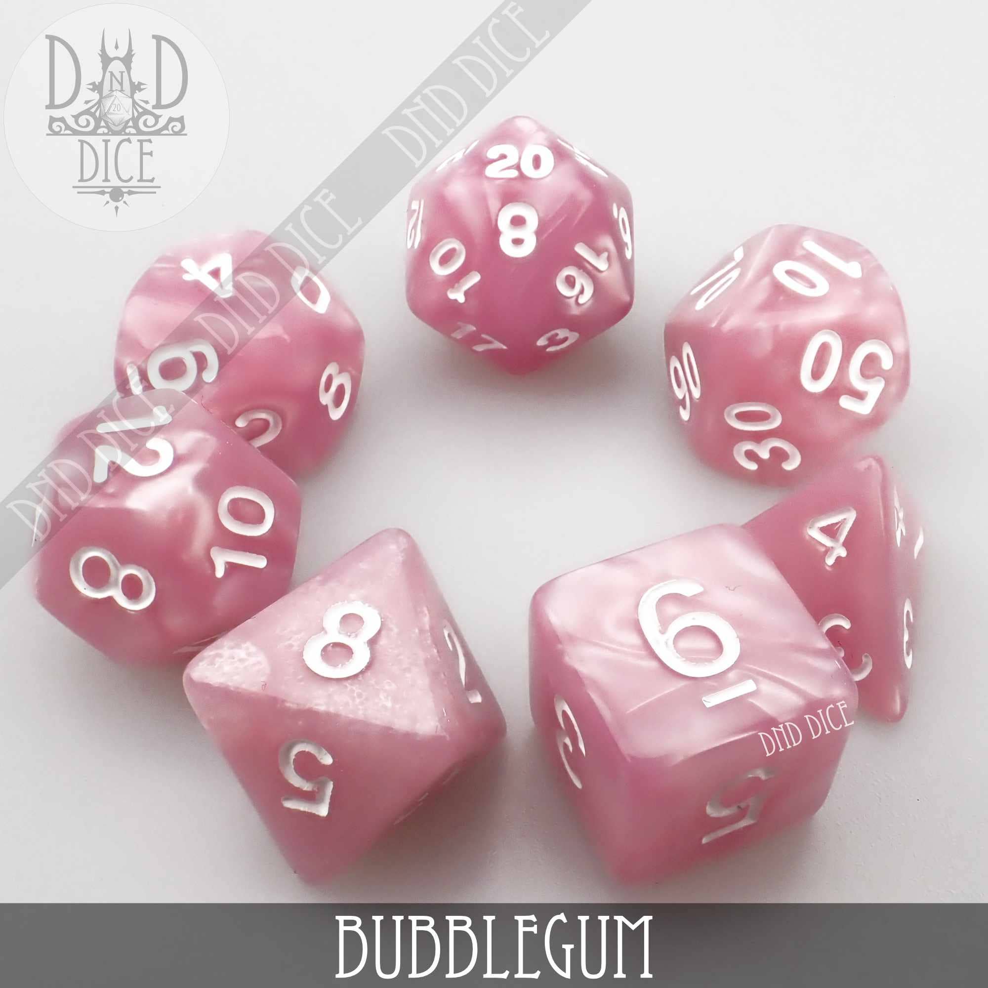 Bubblegum, 7-piece pink pearlescent acrylic dice set with white numbers.