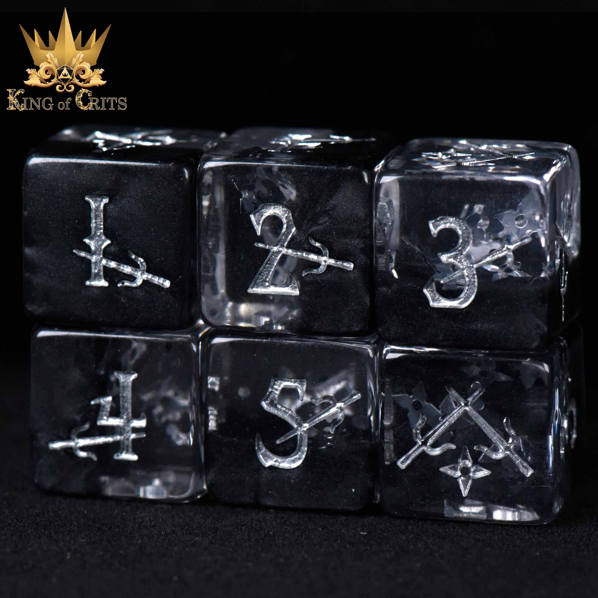 Art of Stealth 11 Dice Set: Black and clear resin dice with silver numbers and sword designs.