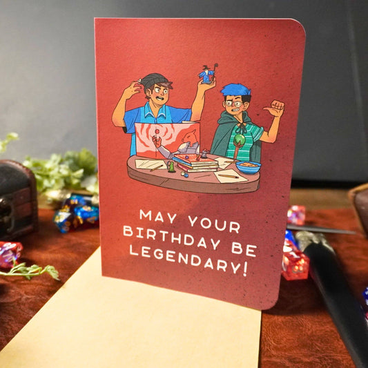 May Your Birthday Be Legendary Card featuring two people playing a fantasy game and the message on front.