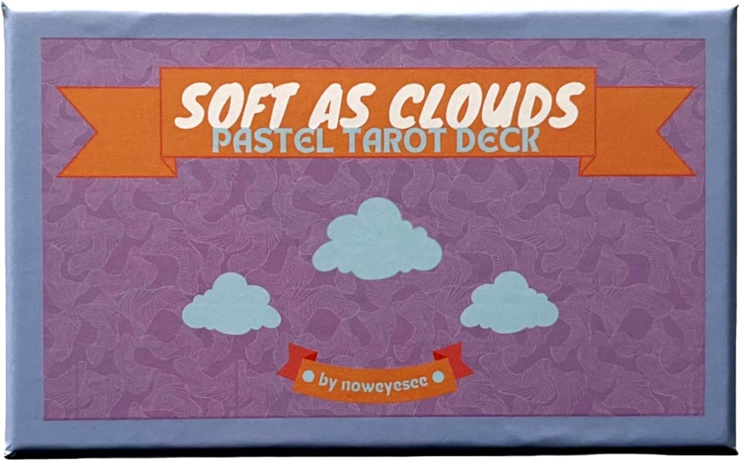 Soft as Clouds Pastel Tarot Deck & Guidebook box with three clouds on a purple patterned background.