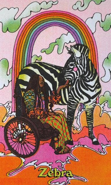 Queer Animal Oracle deck featuring a woman in a wheelchair beside a zebra under a rainbow.