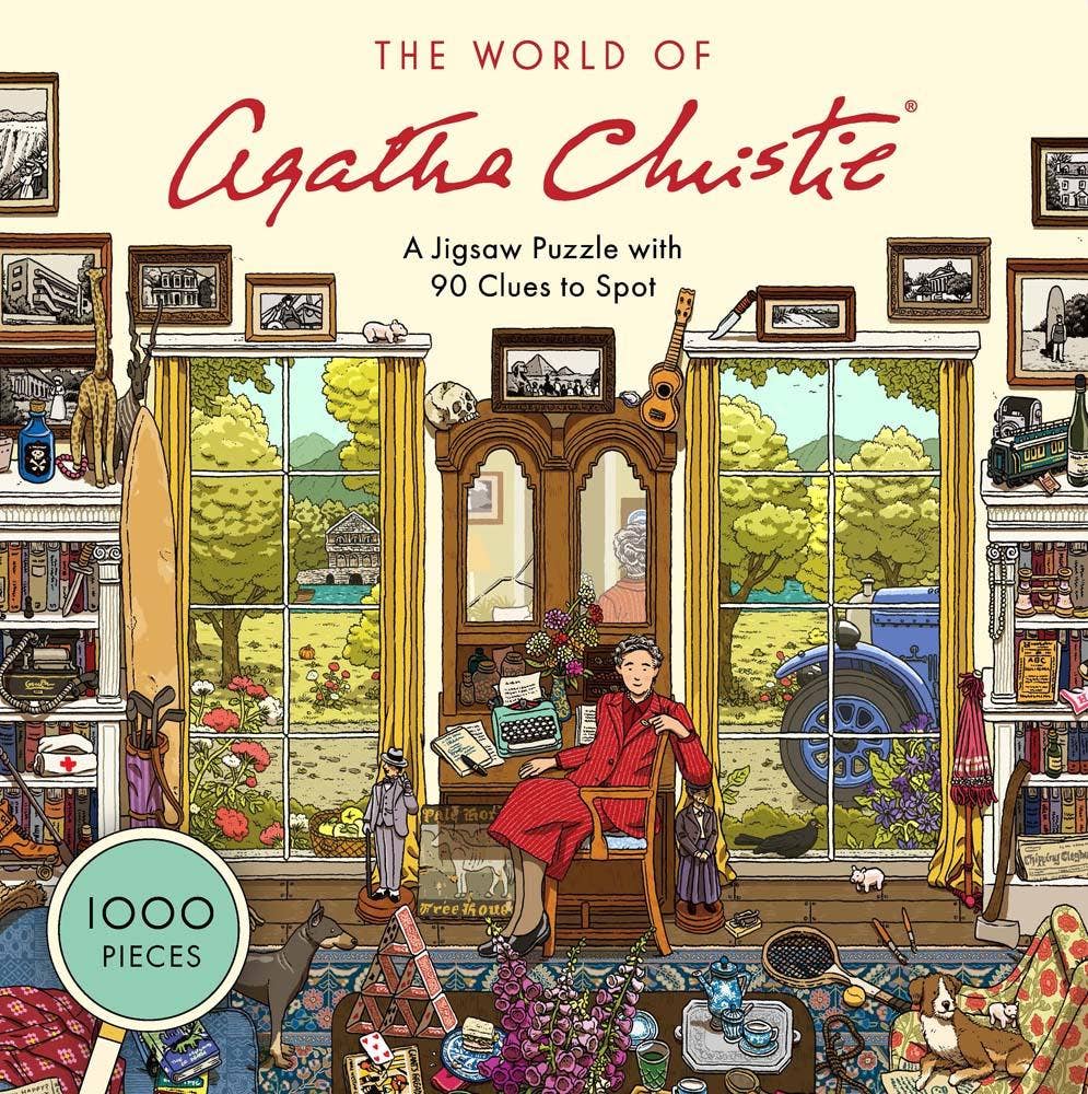 The World of Agatha Christie 1000 Piece Puzzle on a table with books; woman reading in background.